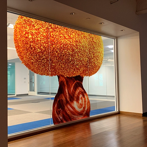 Vibrant abstract tree design window mural, enhancing the aesthetic of a modern retail or office space.
