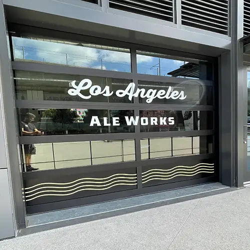 Storefront with professional vinyl decal letters on glass, displaying business information clearly and attractively